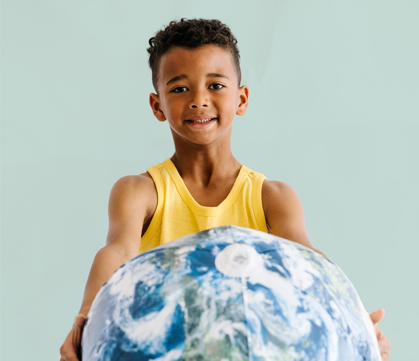 boy holding a globe